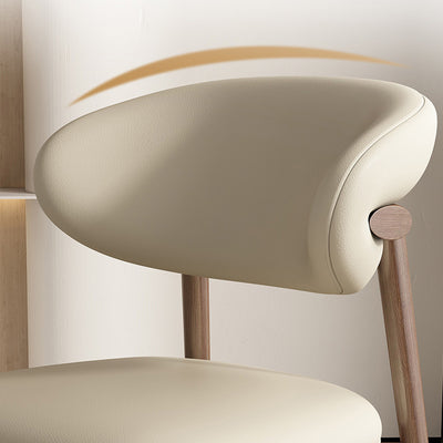 Silla de comedor contemporánea nórdica de madera y cuero sintético con respaldo redondo para comedor 