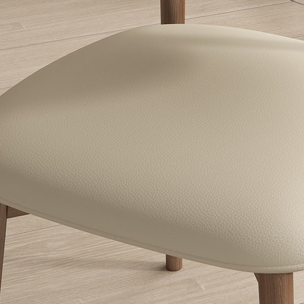 Silla de comedor contemporánea nórdica de madera y cuero sintético con respaldo redondo para comedor 