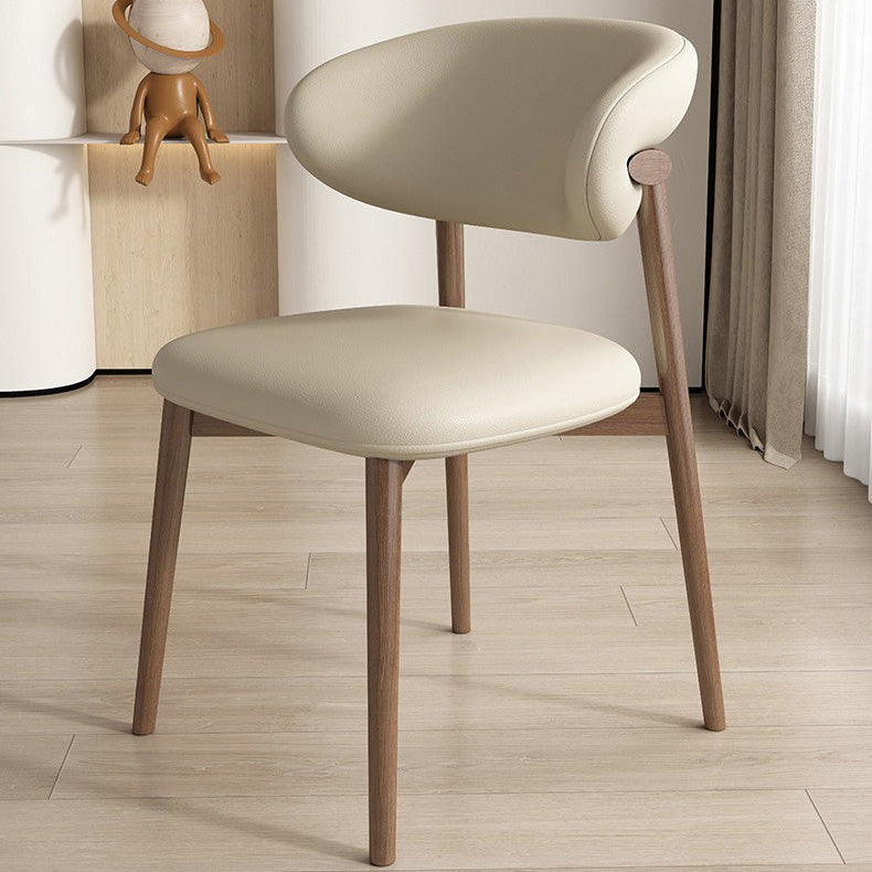 Silla de comedor contemporánea nórdica de madera y cuero sintético con respaldo redondo para comedor 