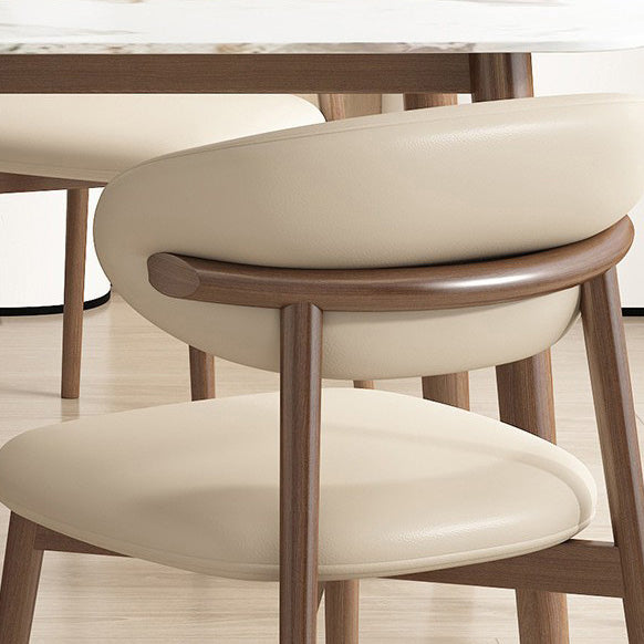 Silla de comedor contemporánea nórdica de madera y cuero sintético con respaldo redondo para comedor 