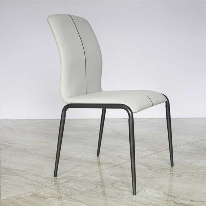 Chaise de salle à manger moderne minimaliste incurvée avec dossier en cuir PU, acier au carbone et éponge pour salle à manger 