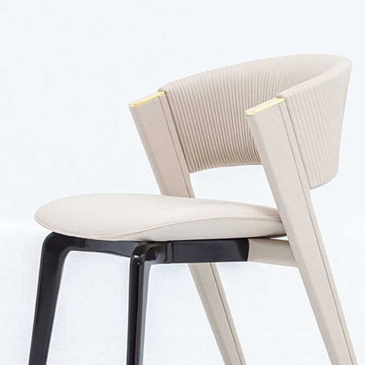 Moderner minimalistischer gebogener PU-Leder Massivholz Schwamm Edelstahl Esszimmerstuhl Rückenlehne für Esszimmer 