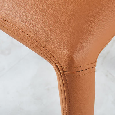 Moderna silla de comedor minimalista cuadrada tapizada en cuero artificial con respaldo de acero al carbono para comedor 