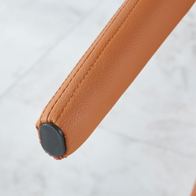 Moderna silla de comedor minimalista cuadrada tapizada en cuero artificial con respaldo de acero al carbono para comedor 