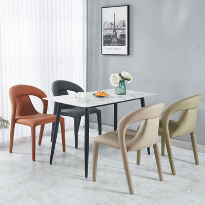 Moderna silla de comedor minimalista cuadrada tapizada en cuero artificial con respaldo de acero al carbono para comedor 