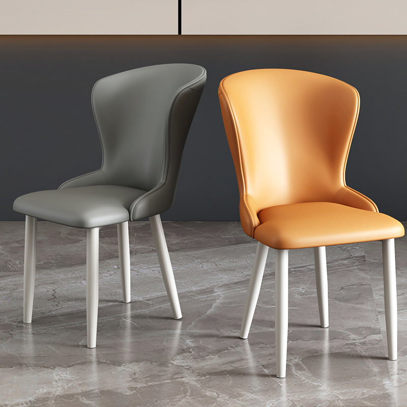 Silla de comedor de acero al carbono con respaldo tapizado en cuero artificial rectangular cuadrado nórdico contemporáneo para comedor 
