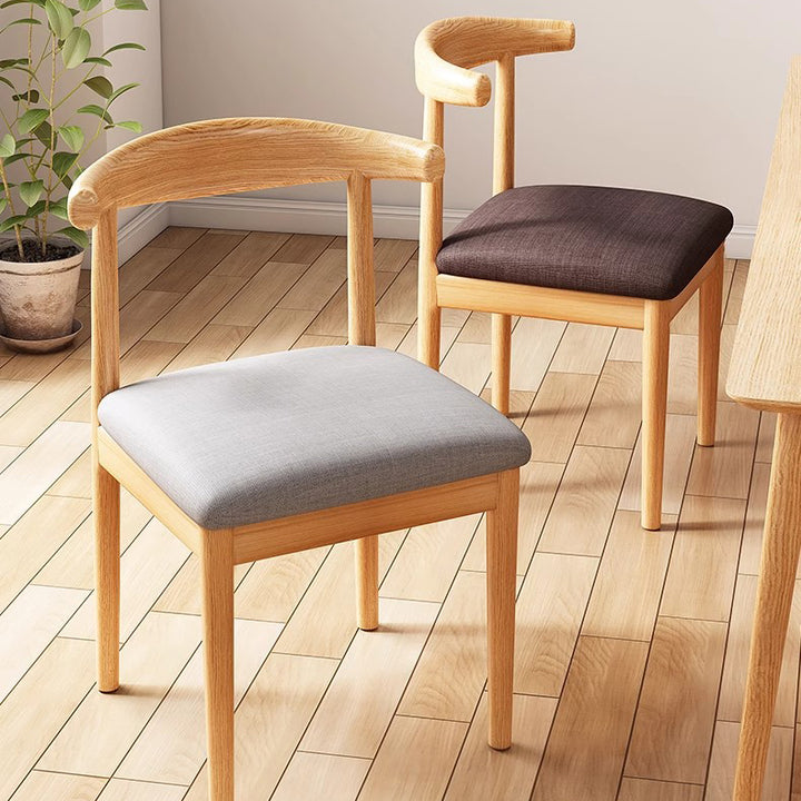 Chaise de salle à manger contemporaine en forme de coin de vache nordique moderne avec dossier carré rembourré en tissu coton lin PU cuir cadre en acier 