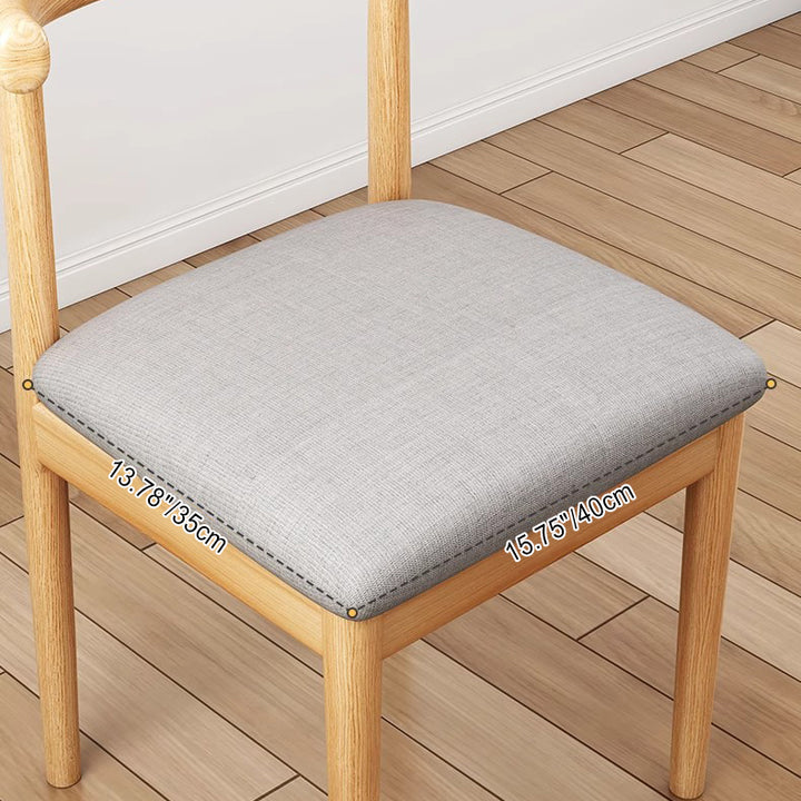 Chaise de salle à manger contemporaine en forme de coin de vache nordique moderne avec dossier carré rembourré en tissu coton lin PU cuir cadre en acier 