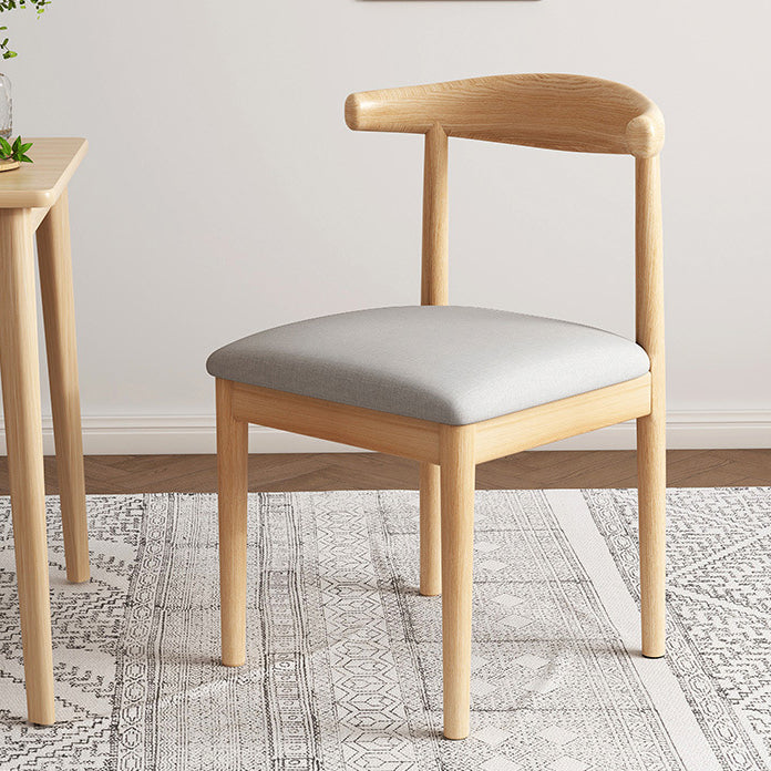 Chaise de salle à manger contemporaine en forme de coin de vache nordique moderne avec dossier carré rembourré en tissu coton lin PU cuir cadre en acier 