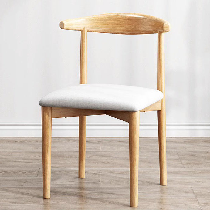Chaise de salle à manger contemporaine en forme de coin de vache nordique moderne avec dossier carré rembourré en tissu coton lin PU cuir cadre en acier 