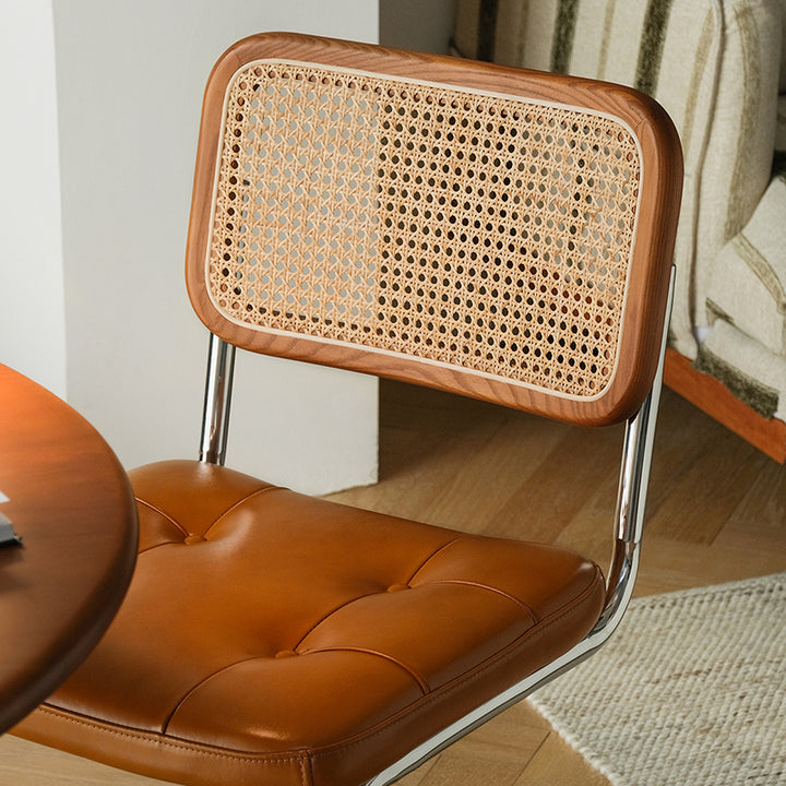 Chaise de salle à manger traditionnelle vintage en arc en acier inoxydable avec dosseret en cuir, éponge, plastique et rotin tissé sans accoudoirs 