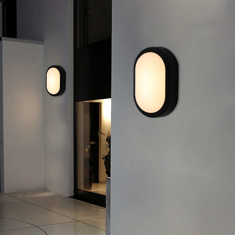 Luz de pared exterior LED ovalada de aluminio y PC minimalista moderna, impermeable para patio y balcón 