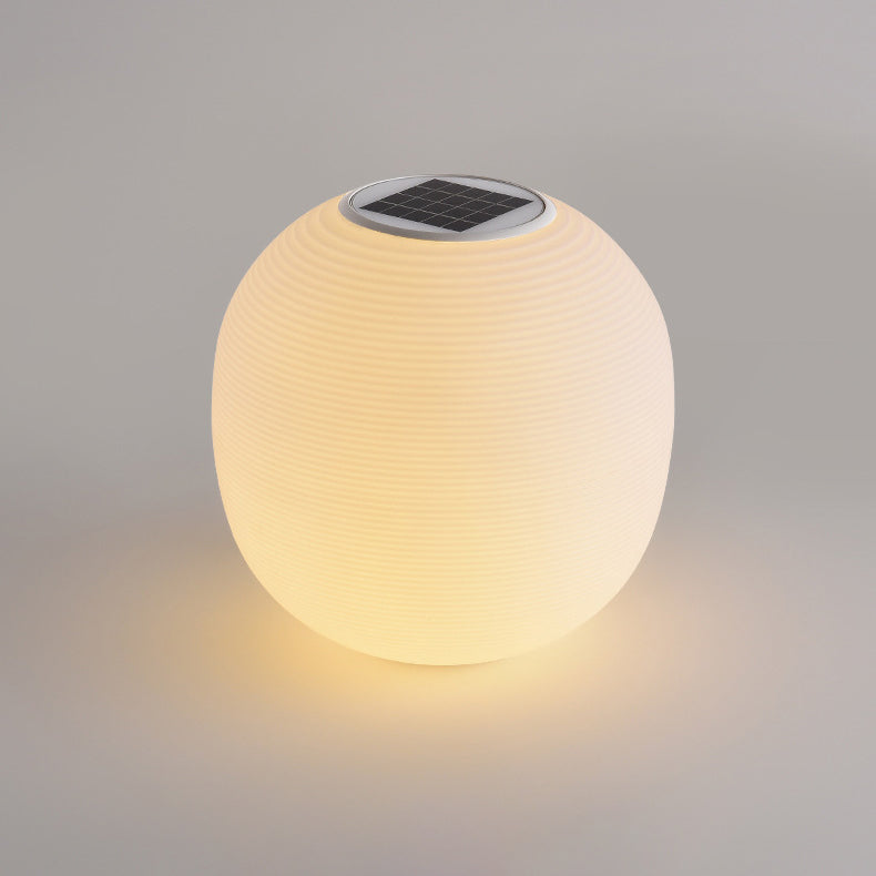 Lumière extérieure moderne minimaliste PE ovale à LED solaire et étanche pour jardin et patio 