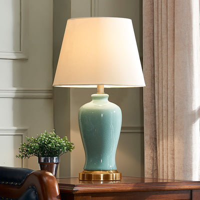 Zeitgenössische nordische Keramikstoff Elliptische Basis 1-Licht Tischlampe für Schlafzimmer und Wohnzimmer 