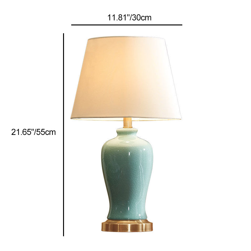 Zeitgenössische nordische Keramikstoff Elliptische Basis 1-Licht Tischlampe für Schlafzimmer und Wohnzimmer 