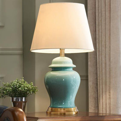 Zeitgenössische nordische Keramikstoff Elliptische Basis 1-Licht Tischlampe für Schlafzimmer und Wohnzimmer 