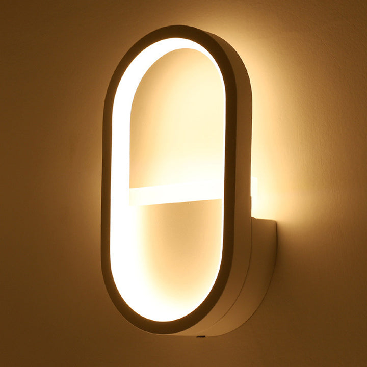 Applique murale LED ovale minimaliste moderne en fer, aluminium et acrylique pour chambre 