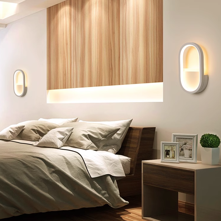 Applique murale LED ovale minimaliste moderne en fer, aluminium et acrylique pour chambre 
