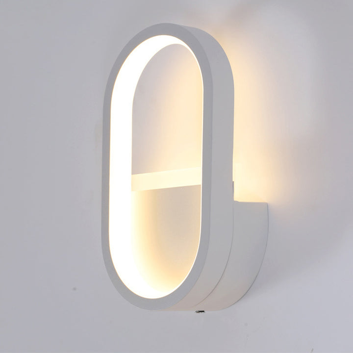 Applique murale LED ovale minimaliste moderne en fer, aluminium et acrylique pour chambre 