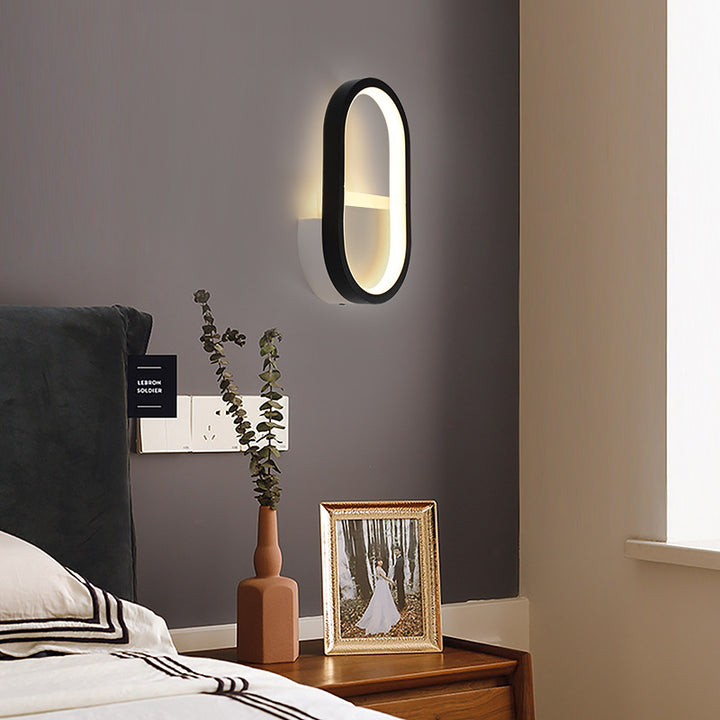 Applique murale LED ovale minimaliste moderne en fer, aluminium et acrylique pour chambre 