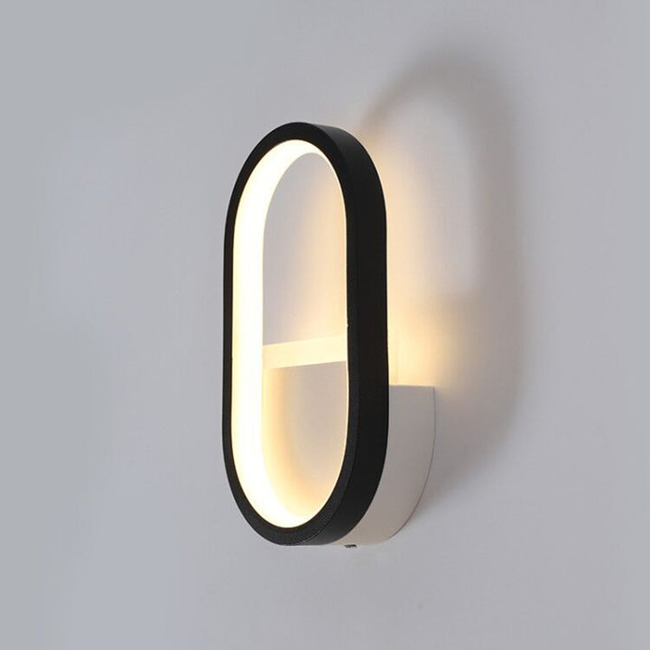 Applique murale LED ovale minimaliste moderne en fer, aluminium et acrylique pour chambre 