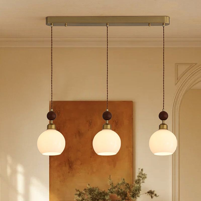 Zeitgenössischer Retro-Kronleuchter mit runder Kugel und ovaler Hardware, Holz- und Glasschirm, 1/3-flammig, Inselleuchte für Esszimmer 