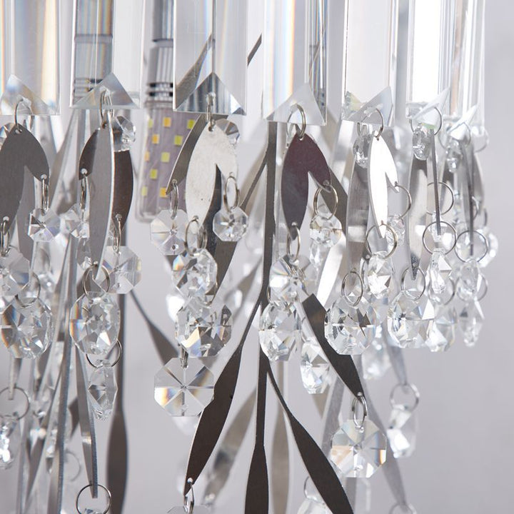 Lampe murale moderne de luxe à un éclairage avec abat-jour rond en cristal, cadre en acier inoxydable et bras courbé pour chambre 