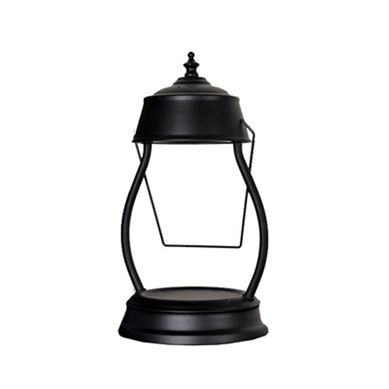 Zeitgenössische kreative runde Laternenform Eisen 1-Licht Aroma Schmelzwachs Tischlampe für Schlafzimmer 