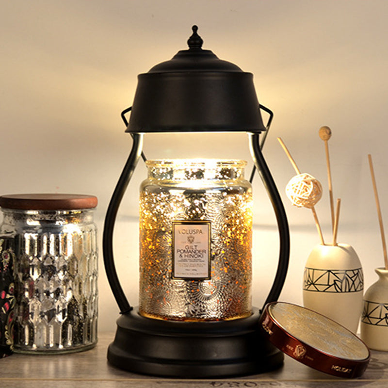 Zeitgenössische kreative runde Laternenform Eisen 1-Licht Aroma Schmelzwachs Tischlampe für Schlafzimmer 