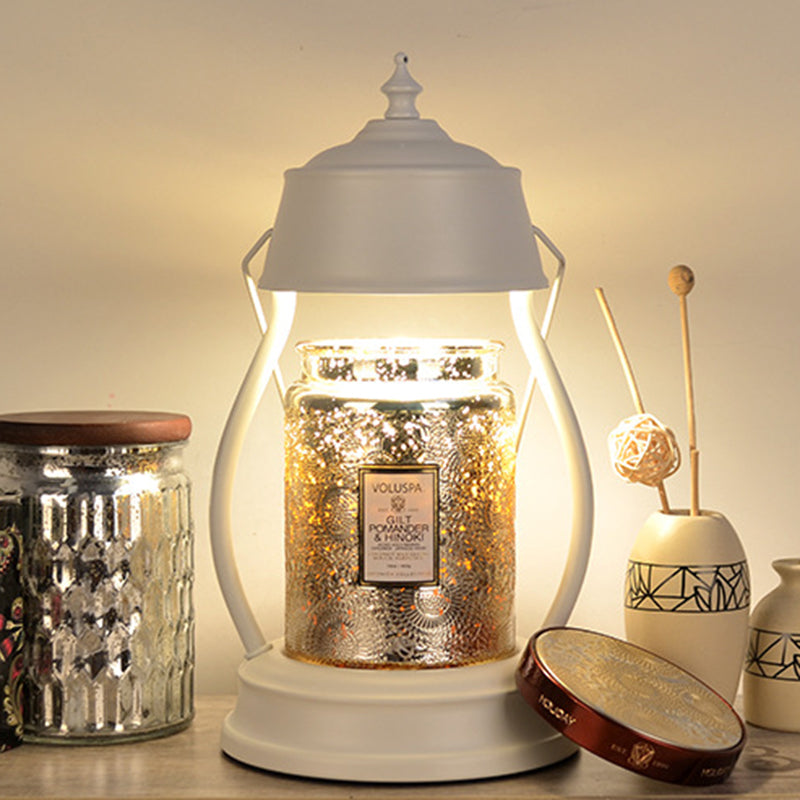 Zeitgenössische kreative runde Laternenform Eisen 1-Licht Aroma Schmelzwachs Tischlampe für Schlafzimmer 
