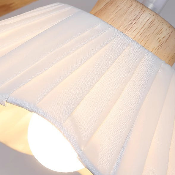 Zeitgenössische nordische Wandlampe mit Dreibein-Basis, rundem Blumenstoff, Glasschirm und Holz 1-Licht für Schlafzimmer 