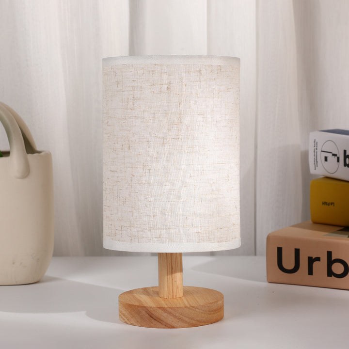 Lámpara de mesa LED con pantalla de tela y base cilíndrica de madera de estilo Art Deco moderno para dormitorio 