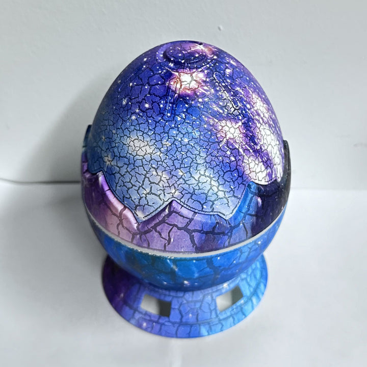 Moderne Art Deco Crackle Dinosaurier-Ei-Projektor ABS LED Tischlampe für das Schlafzimmer 