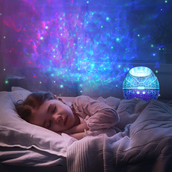 Moderne Art Deco Crackle Dinosaurier-Ei-Projektor ABS LED Tischlampe für das Schlafzimmer 