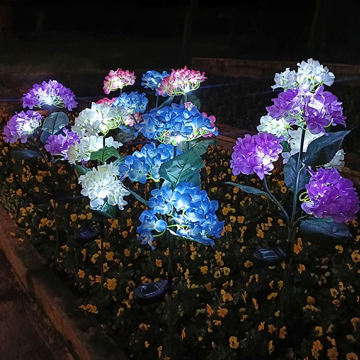 現代的なクリエイティブクロス人工花LEDソーラー防水芝生挿入ライト屋外パティオ用 
