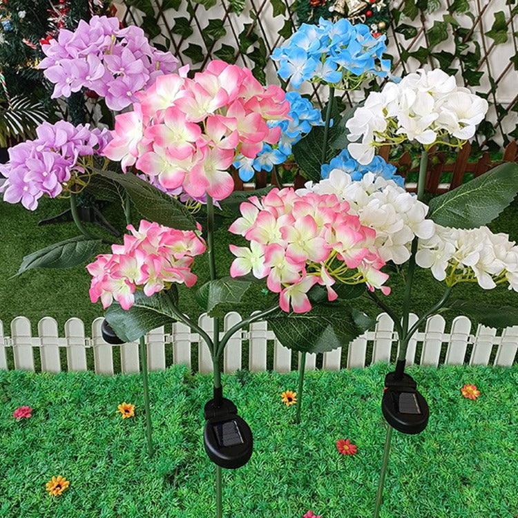 現代的なクリエイティブクロス人工花LEDソーラー防水芝生挿入ライト屋外パティオ用 