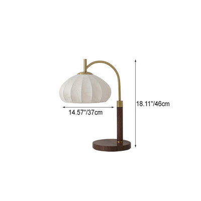 Traditionelle chinesische runde ovale Kegelblumenmuster Eisenstoff 1-Licht Tischlampe für das Schlafzimmer 