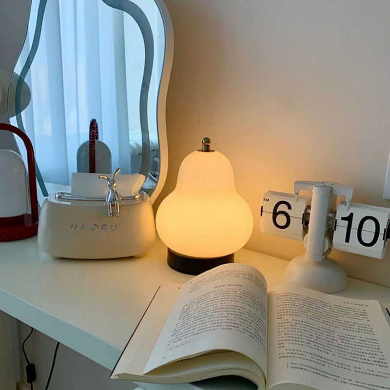 Modern Minimalist Cream Pear Disc Base Hardware Glass LED Table Lamp For Bedroom