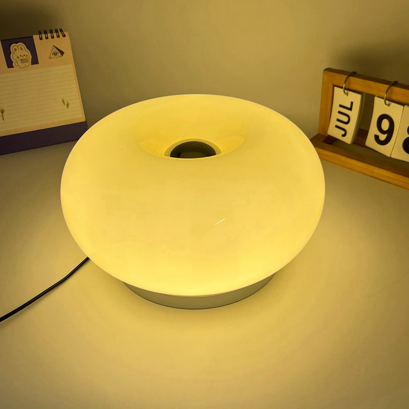 Lámpara de mesa LED de hierro con vidrio ovalado en crema minimalista moderna para dormitorio 