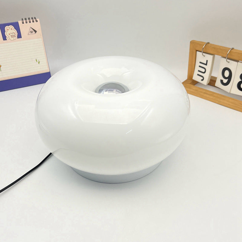 Lámpara de mesa LED de hierro con vidrio ovalado en crema minimalista moderna para dormitorio 