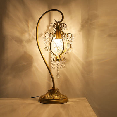 Lampe de table contemporaine de luxe avec cadre en fer courbé et décoration en cristal à 1 lumière pour chambre à coucher 