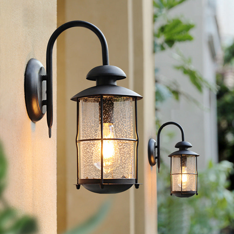 Zeitgenössische Einfachheit Eisenrahmen Glaszylinder 1-Licht Outdoor Wasserdichte Wandleuchte für Garten 