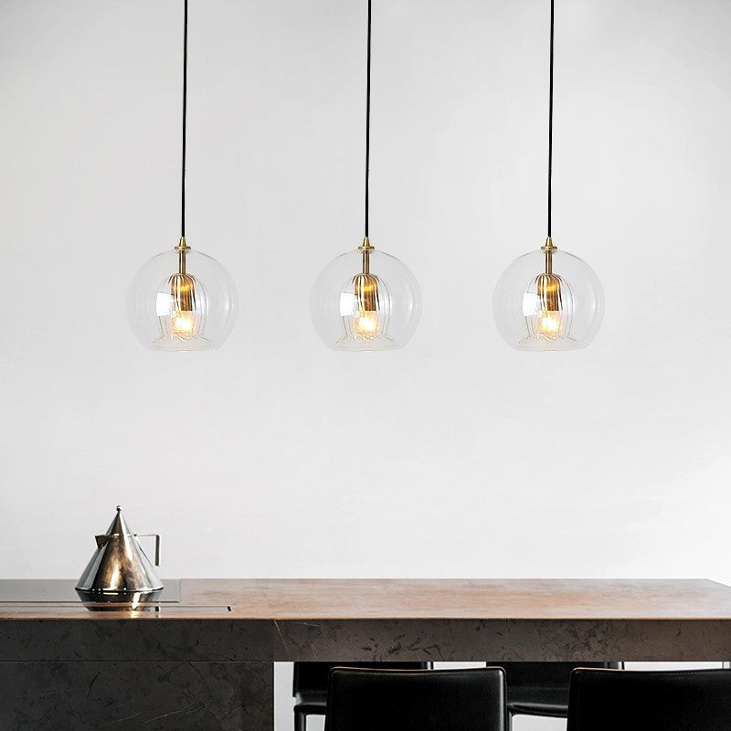 Zeitgenössische nordische runde Kugel Eisen Glas 1-Licht Pendelleuchte für das Esszimmer 