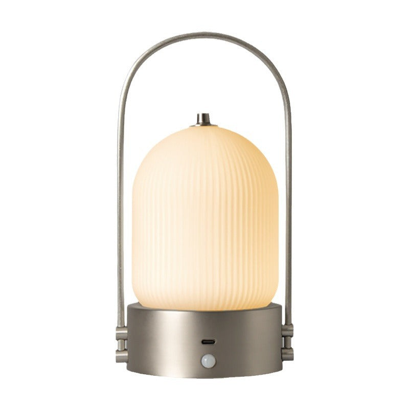 Lámpara de mesa LED USB portátil inductiva de vidrio y hierro metálico ovalado minimalista moderno para dormitorio 