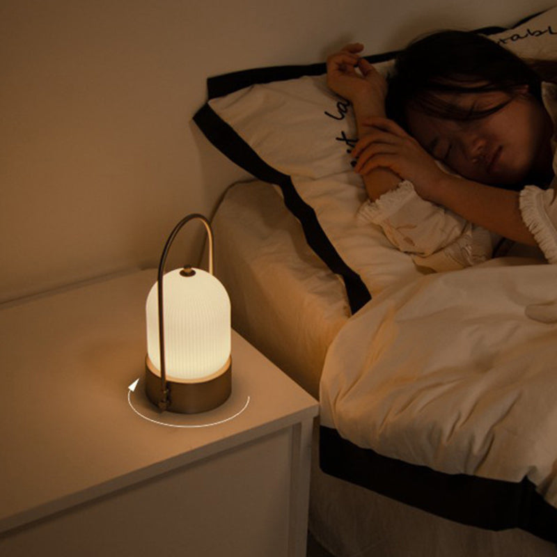 Lámpara de mesa LED USB portátil inductiva de vidrio y hierro metálico ovalado minimalista moderno para dormitorio 