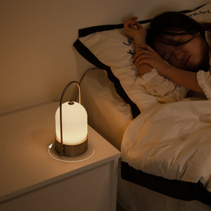 Lámpara de mesa LED USB portátil inductiva de vidrio y hierro metálico ovalado minimalista moderno para dormitorio 