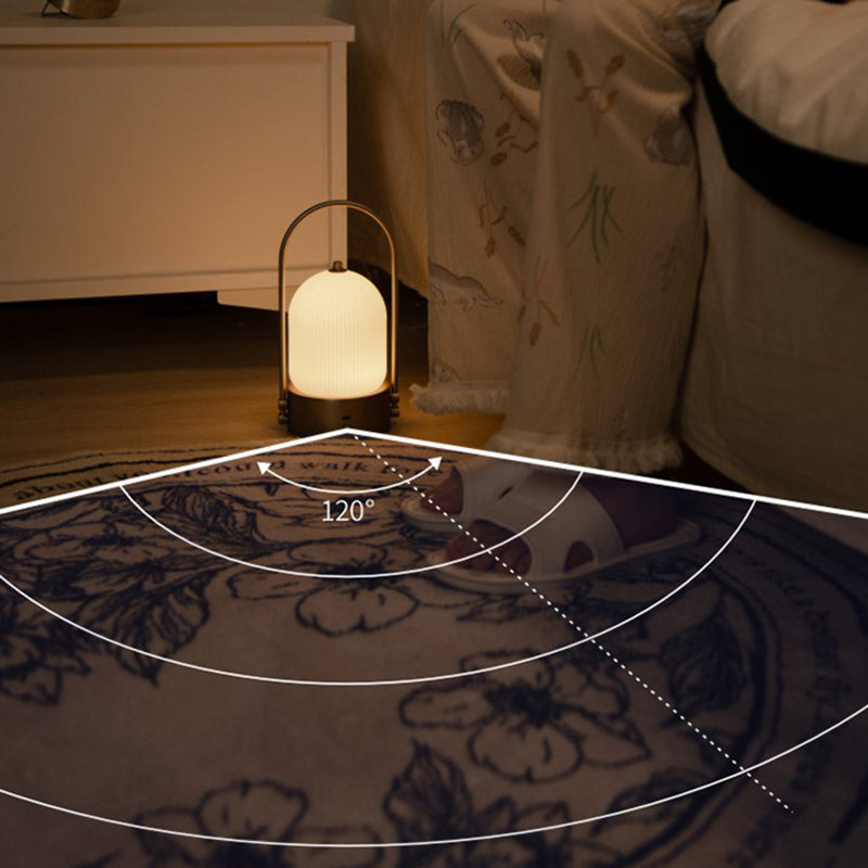 Lámpara de mesa LED USB portátil inductiva de vidrio y hierro metálico ovalado minimalista moderno para dormitorio 