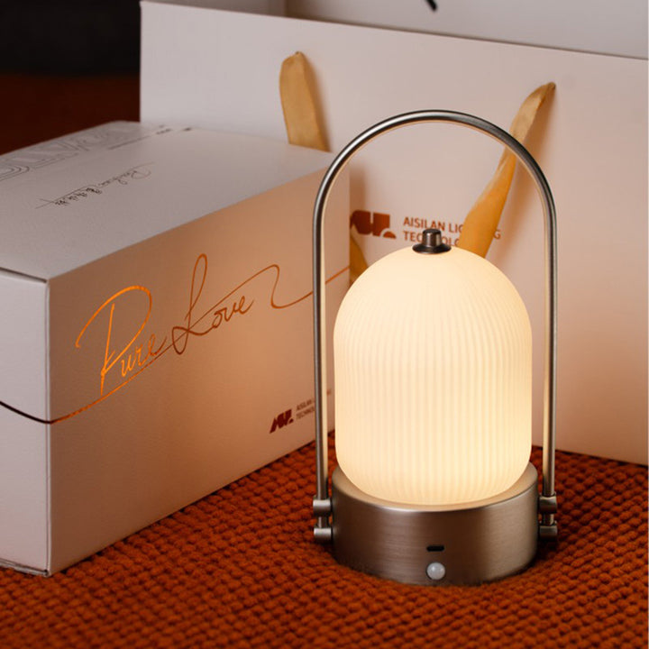 Lámpara de mesa LED USB portátil inductiva de vidrio y hierro metálico ovalado minimalista moderno para dormitorio 