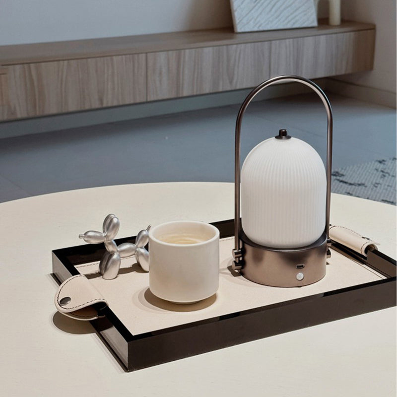 Lámpara de mesa LED USB portátil inductiva de vidrio y hierro metálico ovalado minimalista moderno para dormitorio 