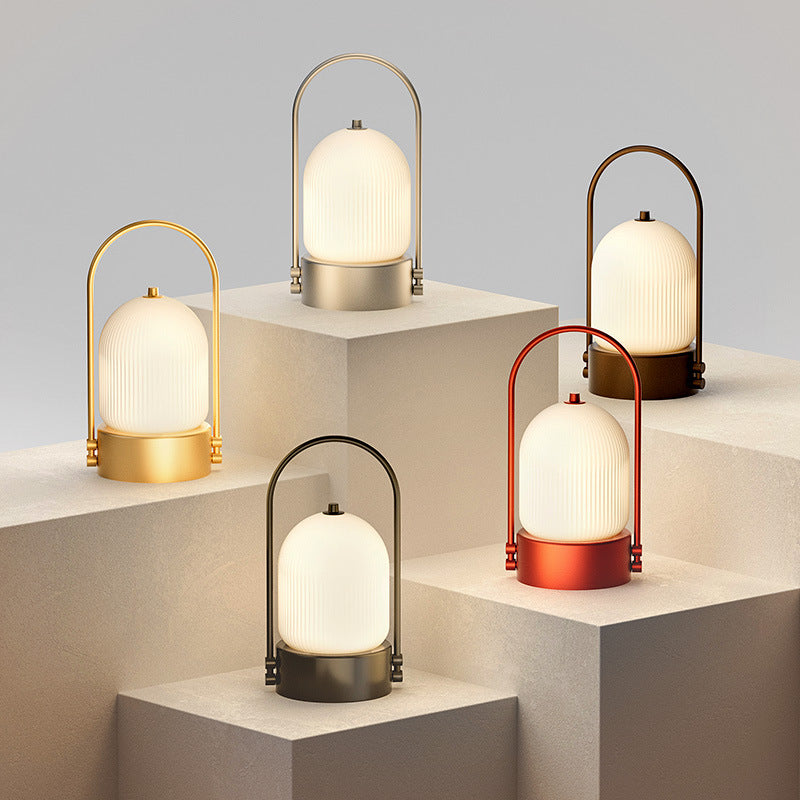 Lámpara de mesa LED USB portátil inductiva de vidrio y hierro metálico ovalado minimalista moderno para dormitorio 